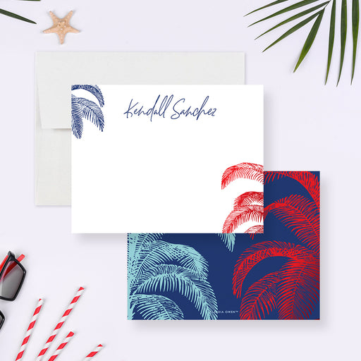White personalized note card with red and blue palm trees, beside a navy back patterned with red white and blue palms.