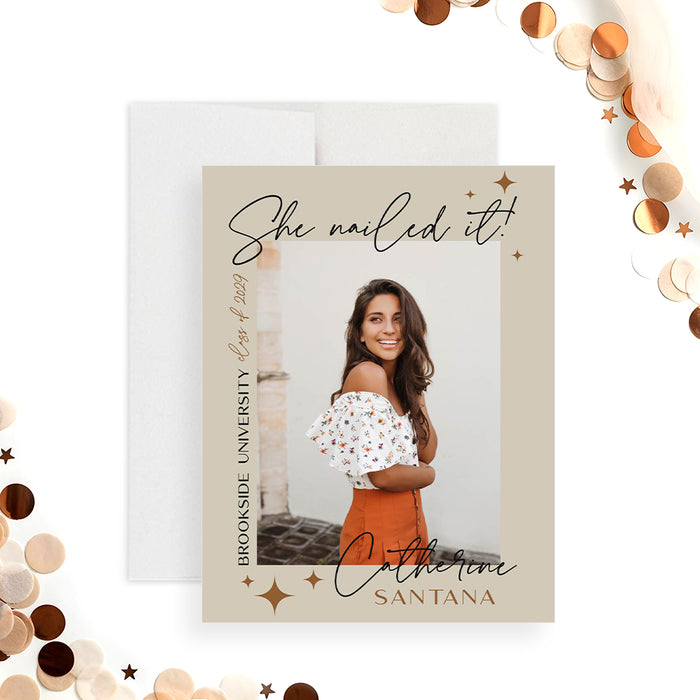 Neutral-toned graduation announcement card with photo, “She nailed it” script, star accents, and personalized details-front