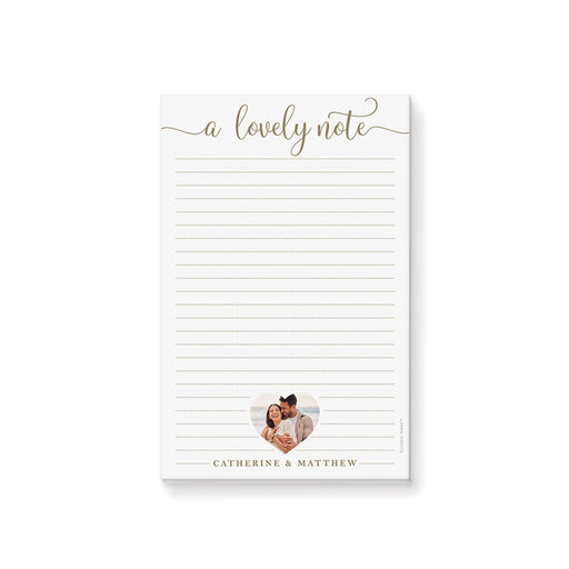 Personalized lined notepad featuring A Lovely Note lettering, a couple photo in a heart-shaped frame and names along the bottom