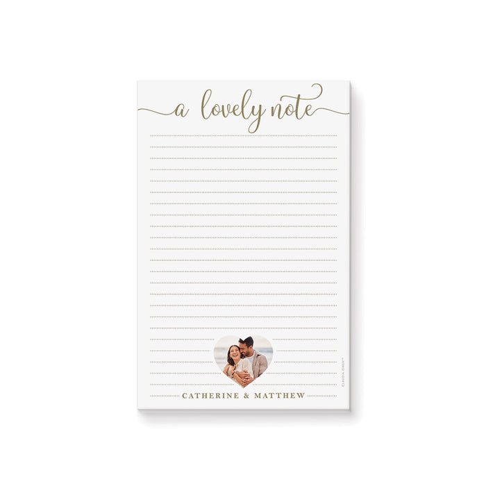 Personalized lined notepad featuring A Lovely Note lettering, a couple photo in a heart-shaped frame and names along the bottom