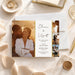 Personalized photo wedding announcement card featuring romantic sunset couple photos, elegant black script names, a white center panel with gold accents, wedding details, and a matching envelope