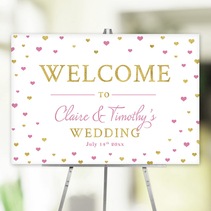 Personalized pink and gold heart wedding welcome sign with scattered heart pattern, custom couple’s names and wedding date