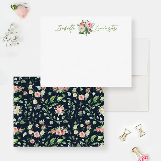 Personalized floral note cards with a pink rose bouquet and script name on the white front and pink roses and green leaves on a navy reverse.