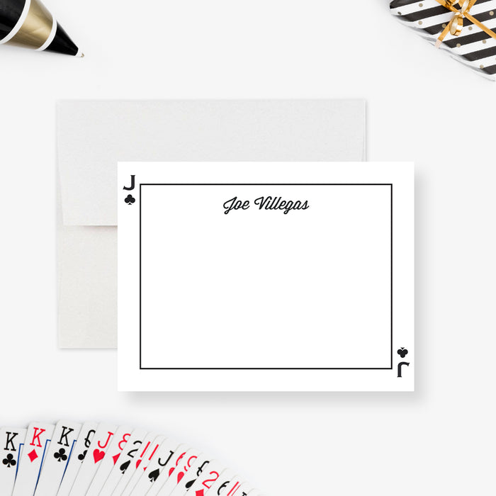 Personalized note card with a white front with black clubs symbols, a thin playing-card border, and personalized script name. Shown with a white envelope.