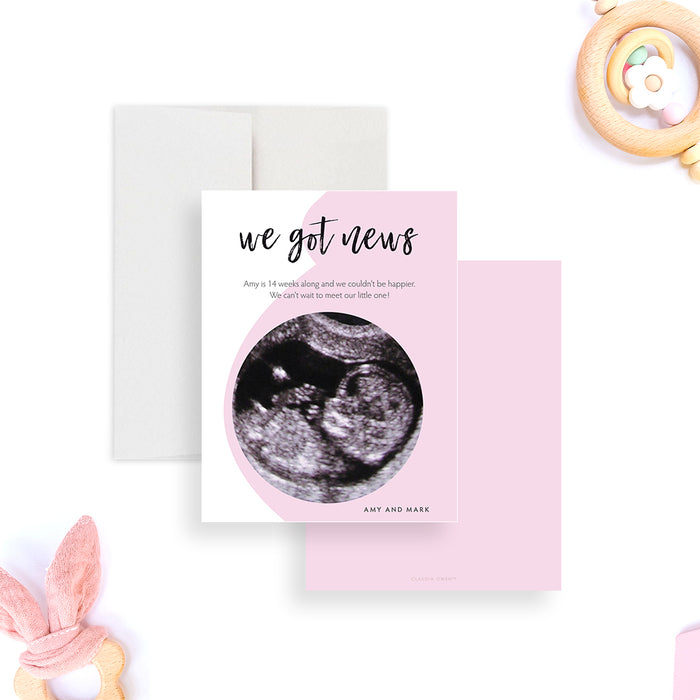 Personalized pregnancy announcement card with ultrasound photo, “we got news” message, soft pink design and custom parents’ names-front-back