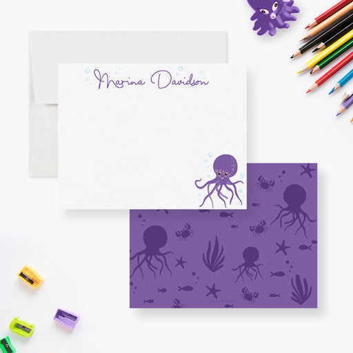 Personalized white note card with a purple octopus and name, beside the purple back patterned with sea creatures.