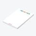 Personalized white notepad with a name in colorful rainbow lettering and blank space for writing.