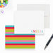 Personalized white note cards with colorful name lettering and a reverse covered in bright horizontal rainbow stripes.