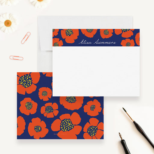 Personalized floral note cards with red flowers on a navy band above the white writing area and a matching red and navy floral reverse.
