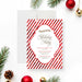Personalized holiday party invitation with red and white diagonal candy cane stripes and event details-front