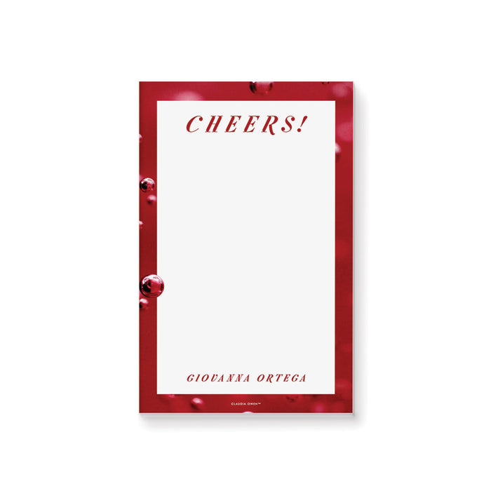 personalized red cocktail party notepad with Cheers wording, bubbly drink-inspired border, custom name, and blank writing space