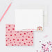 Personalized note cards with hands forming a heart beside the name on the white front and red and pink hearts on the pink reverse.