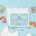 Personalized blue Sip and See baby save the date card with baby stroller, baby’s name, and celebration date-front