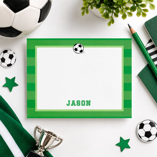 Personalized soccer note card with a black-and-white soccer ball, green striped border, white writing space, and custom name.