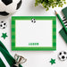 Personalized soccer note card with a black-and-white soccer ball, green striped border, white writing space, and custom name.