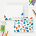Front and back of personalized note cards with colorful puzzle pieces, a personalized name and job title and a colorful puzzle piece patterned back.