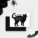Personalized Halloween party invitation with a large hand-drawn black cat, glowing yellow eyes, white event wording and costume request-front-back