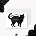 Personalized Halloween party invitation with a large hand-drawn black cat, glowing yellow eyes, white event wording and costume request-front