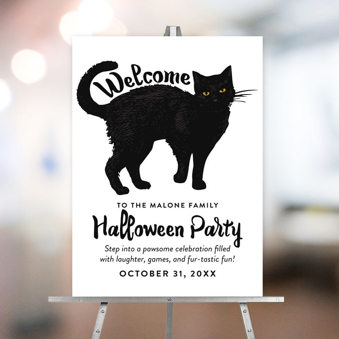 Personalized Halloween party welcome sign with large hand-drawn black cat, yellow eyes, family name, event date and playful cat-themed wording