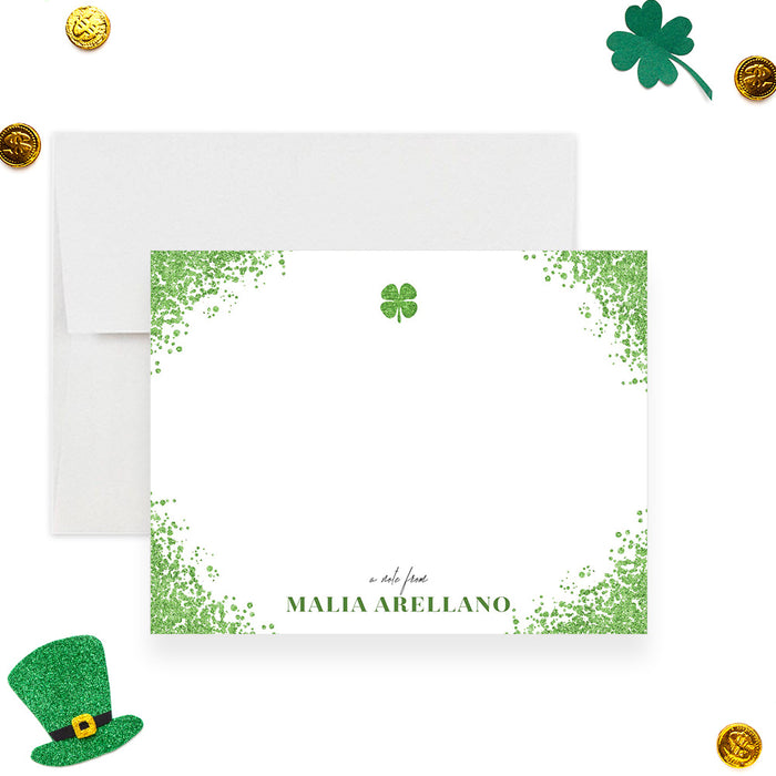 Personalized St. Patrick's Day note card with a green speckled border, four-leaf clover, custom name and blank writing area-front
