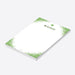 Personalized St. Patrick's Day notepad with a green speckled border, four-leaf clover, custom name and blank writing area-side