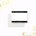 Personalized note card with a white front with black header and footer bands, printed gold confetti, and a name. Shown with a white envelope.