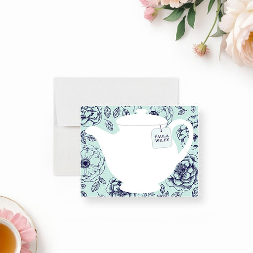 personalized tea party thank you card with white teapot illustration, floral mint background, custom name tea tag, and blank writing space-front