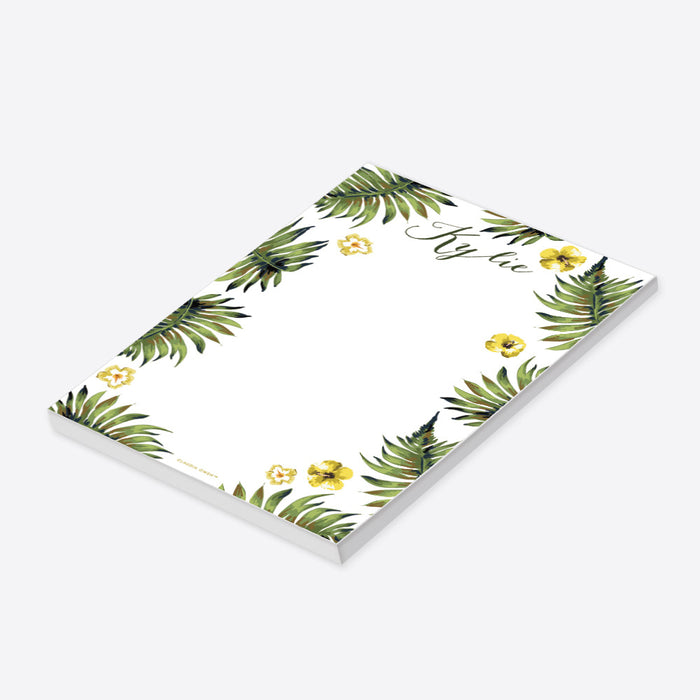 personalized tropical notepad with custom name, green palm leaves, yellow hibiscus flowers, and a clean white writing area-side