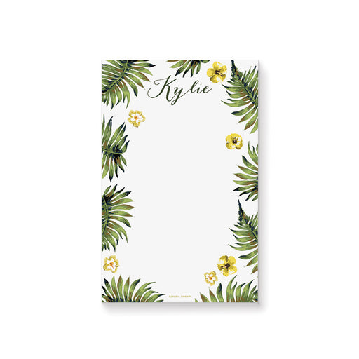 personalized tropical notepad with custom name, green palm leaves, yellow hibiscus flowers, and a clean white writing area