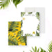 personalized tropical thank you card with custom name, green palm leaves, yellow hibiscus flowers, and white writing area-front-back