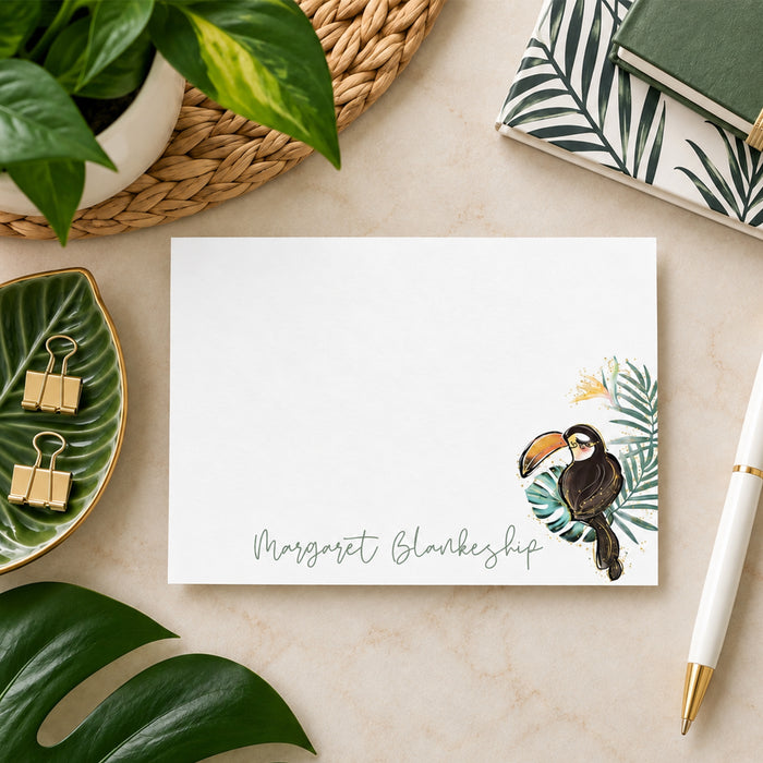 Personalized tropical toucan note card with lush green leaves and custom name