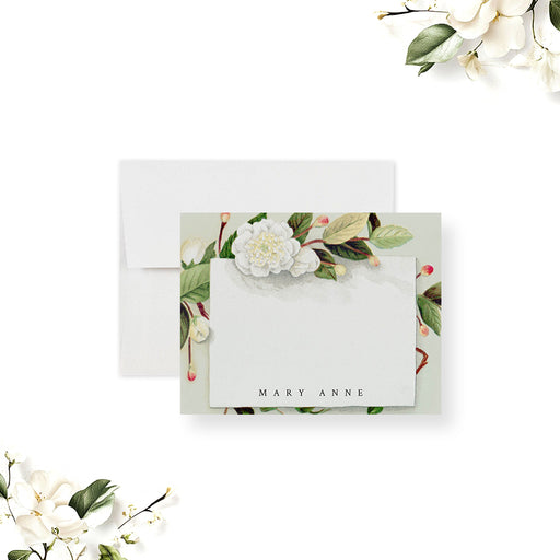 Personalized pale green floral note card with white flowers and leafy branches around a white writing area.