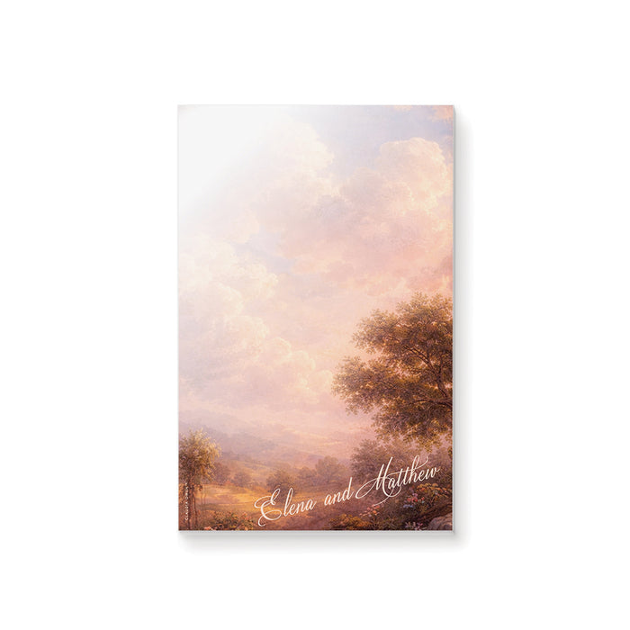 Personalized blank notepad with romantic vintage landscape painting, glowing pink clouds, countryside scenery and custom couple’s names