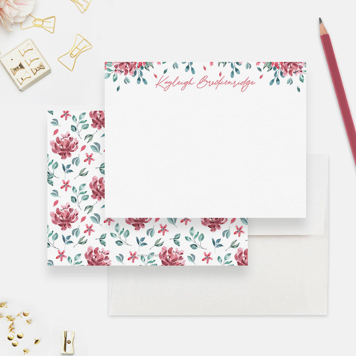 White personalized note card with pink and burgundy watercolor flowers and green leaves, beside a matching floral-patterned back.