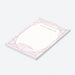 personalized blush pink wedding notepad with jewel-inspired geometric frame, lined pages, refined lettering, and custom couple names-side