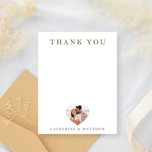 Personalized wedding thank you card with a gold Thank You heading, heart-shaped couple photo, names and blank writing area-front
