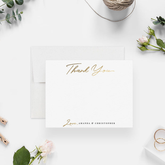 Personalized note card with printed gold thank you lettering and personalized names in script, shown with a white envelope.