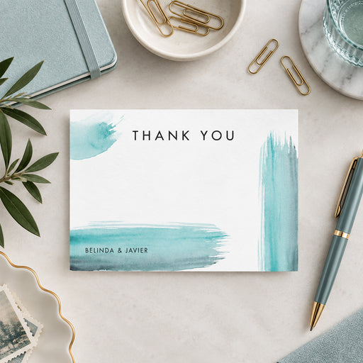 Personalized watercolor thank you card with aqua and teal brushstrokes and couple names-front