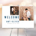 Wedding welcome sign featuring a romantic couple's picture for ceremony or reception entrance decor.