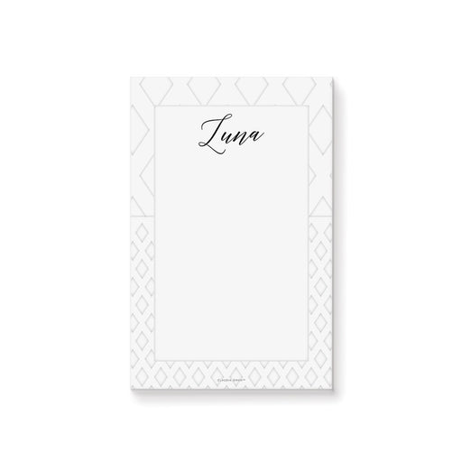 personalized white geometric notepad with custom name, black script lettering, and clean blank writing space