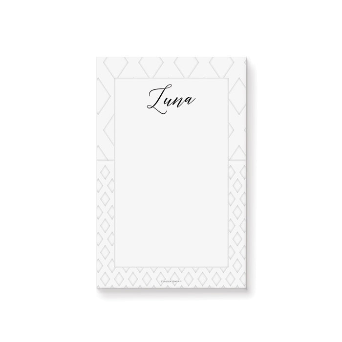 personalized white geometric notepad with custom name, black script lettering, and clean blank writing space