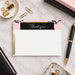Pink and black marble thank-you note card with scripted header, printed gold detail and coordinating reverse