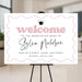 Personalized graduation welcome sign with pink design, custom name, and graduation cap displayed as party entrance sign for Class of 2026