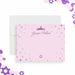 Bat mitzvah thank you card in pink and purple with princess crown, star accents, and personalized name in elegant script design-front