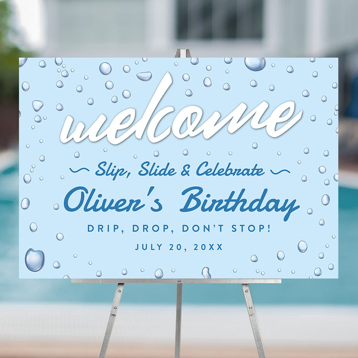 Slip and slide welcome sign with water drop design for kids pool party birthday displayed on easel for summer splash themed celebration