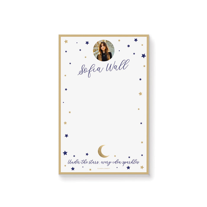 Personalized notepad featuring a photo with navy and gold stars, a crescent moon, and the phrase “Under the stars, every idea sparkles” design.