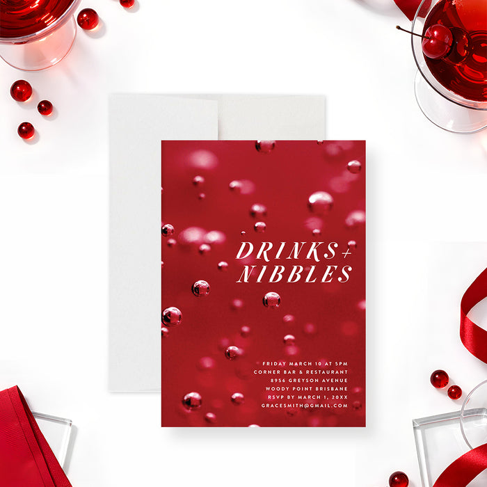 red cocktail party invitation with Drinks and Nibbles wording, bubbly drink-inspired background, and personalized event details-front
