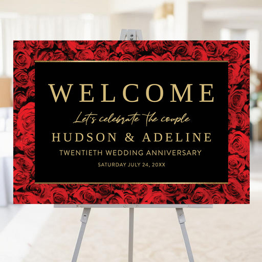 wedding anniversary welcome sign with red rose background and elegant black design displayed on easel