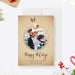 Reindeer Christmas photo card template with a round family photo frame, beige background and Happy Holidays script.