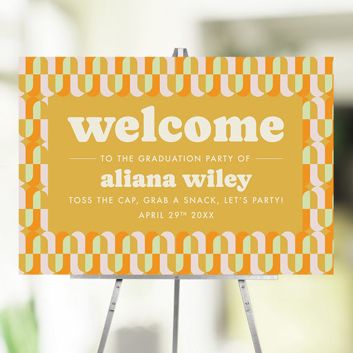 Retro graduation party welcome sign with a colorful geometric pattern